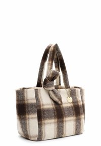Plush tote bag in beige and brown plaid pattern. Features knotted fabric handles and a gold-tone tag accent for added detail.