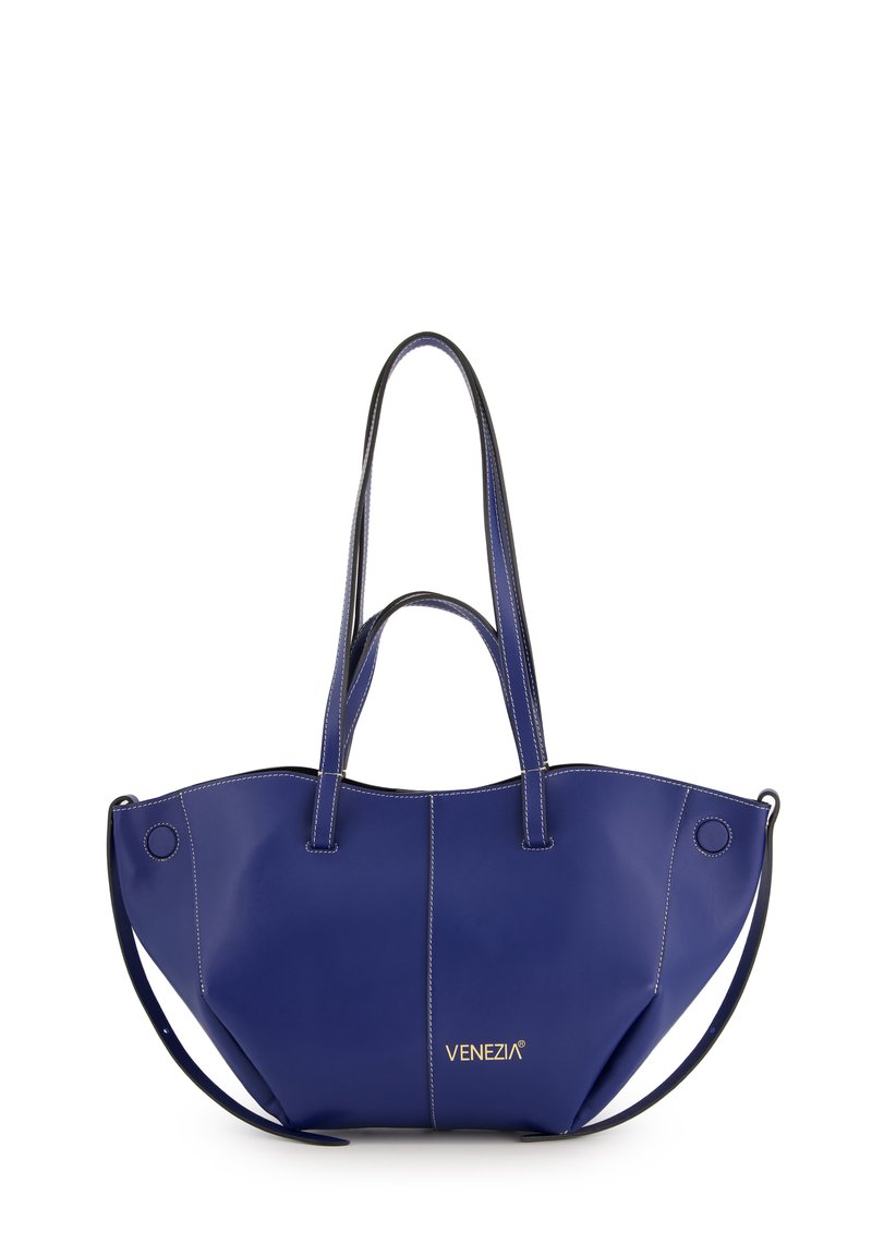 Navy blue leather tote bag with stitched detailing, dual handles, and a single shoulder strap. Features gold logo on the front.
