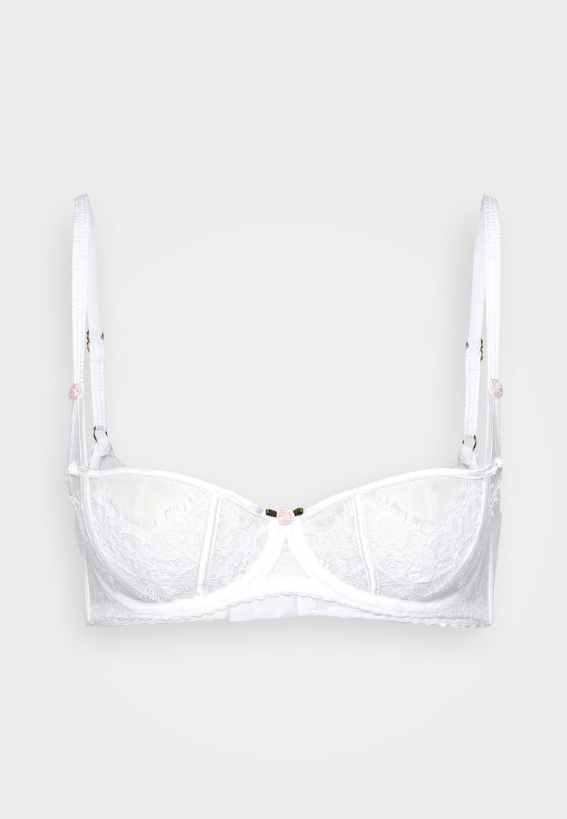 Vitt spetsbehå med bygel, med justerbara band och en liten rosa blomma i mitten. Vågmönstrade kanter och detaljer i mesh.