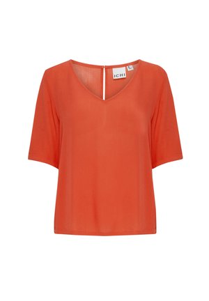 Blouse orange à manches courtes avec un col en V, en tissu léger, et une fermeture au dos. Design simple, sans motifs ni embellissements supplémentaires.