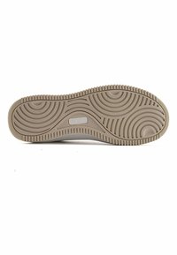 Light brown rubber shoe sole with a wavy pattern, textured for grip, featuring a central logo area with "NINE WEST" embossed.