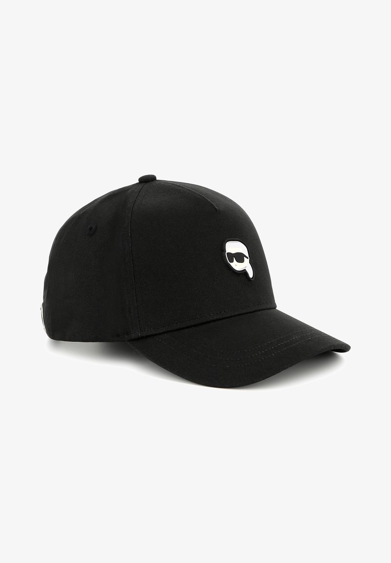 Black baseball cap made of fabric, featuring a rounded crown and a curved visor. A small, white logo with sunglasses is centered on the front.