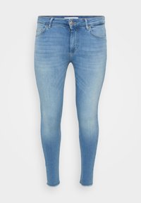 Light blue skinny jeans with a faded wash, five-pocket design, zip fly, and slight fraying at the ankles. Made from denim material.