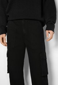 Bershka Kapsáče - black