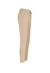 Beige joggebukser laget av myk tekstil, med elastisk midjebånd, snorforbindelse og sidelommer. Slim fit design.