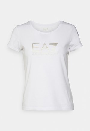 T-shirt bianca in cotone con scollo tondo, maniche corte e logo metallic silver "EA7 EMPORIO ARMANI" stampato sulla parte anteriore.
