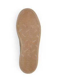 Semelle de chaussure avec un motif de bande de roulement en zigzag, logo "Marc O'Polo", marquage taille 42, et texte "Fabriqué au Portugal" sur un matériau en caoutchouc beige.