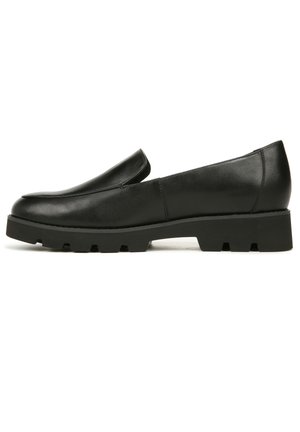 Black leather slip-on shoes with a rounded toe, low-profile design, and a thick, textured rubber sole.