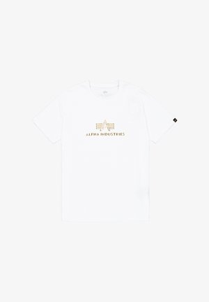 Fehér pamut póló, arany hímzett "ALPHA INDUSTRIES" logóval az elején. Rövid ujjú és kerek nyakú kialakítás.