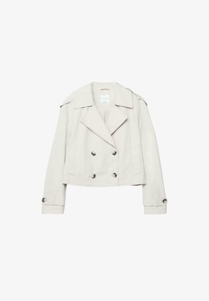 Krémový dvouřadý krátký trenčkot se širokými klopami, ramenními nápadníky, knoflíkovými manžetami a bočními kapsami.