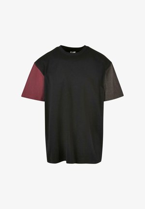 Black t-shirt with short sleeves featuring maroon and dark gray color-blocked accents on the shoulders. Made from soft cotton material.