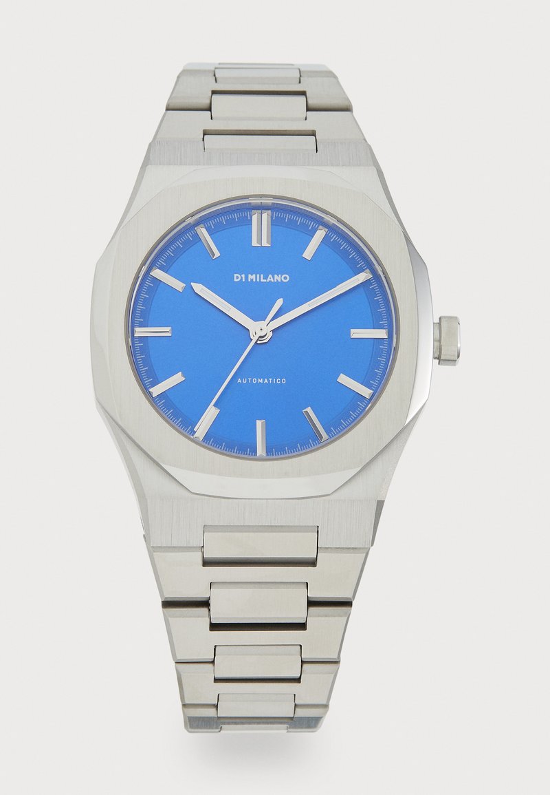 Stainless steel watch with an octagonal case, blue dial, and silver hour markers. Features an automatic movement and a linked bracelet.