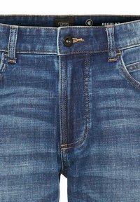 Jeans dżinsowe w ciemnoniebieskim kolorze z przetartym wykończeniem, z czarnym guzikiem, kontrastowymi żółtymi szwami i pięcioma kieszeniami.