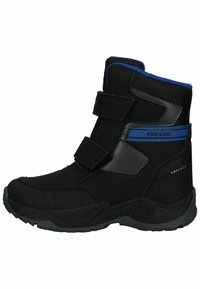 Botas impermeables negras con correas de Velcro, tejido texturizado, suelas de goma y acentos azules. Diseñadas para la durabilidad y la comodidad.