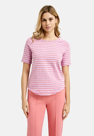 Pink and lavender striped short-sleeve shirt with a rounded hem, made from soft fabric. Worn with fitted pink pants.