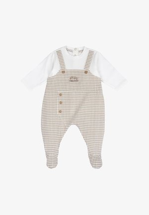 Salopette à carreaux avec un haut blanc à manches longues attaché. Présente un motif à carreaux marron et blanc, des boutons sur le côté, et un tissu doux.