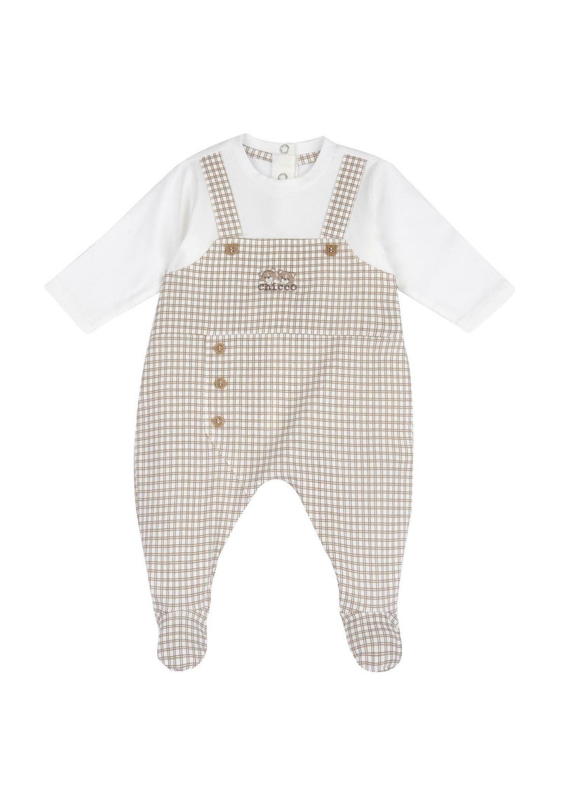 Salopette à carreaux avec un haut blanc à manches longues attaché. Présente un motif à carreaux marron et blanc, des boutons sur le côté, et un tissu doux.