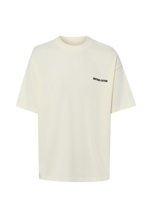 T-shirt en coton écru à manches courtes avec col rond et petit texte noir « "ANOTHER COTTON" » sur la poitrine gauche.