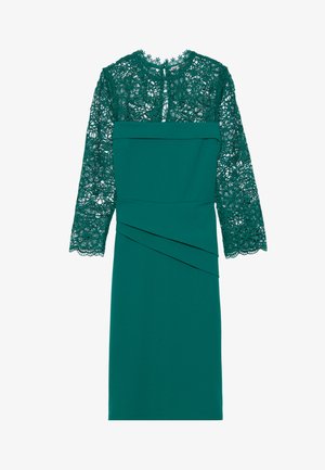 Teal színű ruha csipkebodorrésszel és hosszú, áttetsző ujjaival. A szoknya drapériás részletekkel rendelkezik, amelyek fokozzák a textúrát és a vizuális érdekességet.