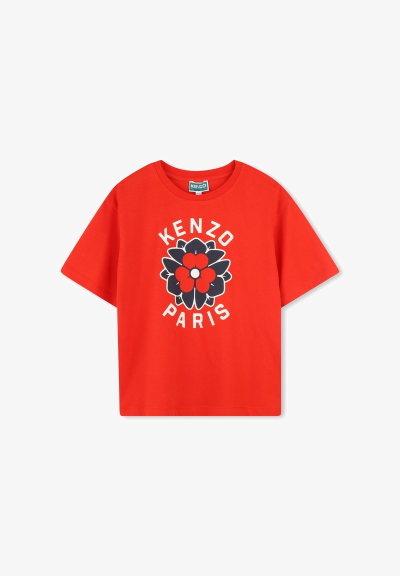 T-shirt en coton rouge avec un graphique floral central en noir et rouge, avec le texte "KENZO PARIS" en blanc en arc au-dessus et en dessous du design.