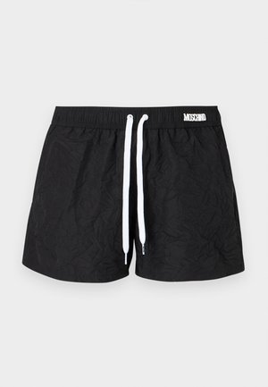 Sorte krøllede badeshorts med elastik i taljen, hvid snor og lille hvid Moschino-logo på højre side.