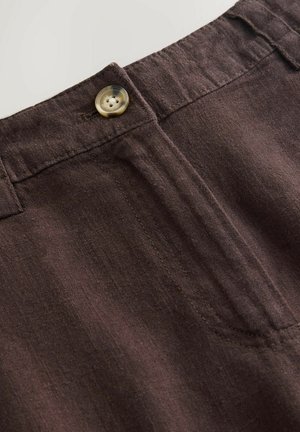 Brown linen pants featuring a front button closure, visible stitching details, and a soft, textured fabric.