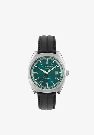Montre-bracelet automatique Aston Martin avec cadran vert, index argentés, guichet date à 3 heures et bracelet en cuir noir.