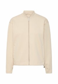 Giacca bomber beige con zip, colletto e polsini a coste, dotata di due tasche laterali e una superficie liscia. Design semplice e funzionale.