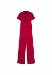 Tuta rossa con maniche corte, colletto alto, dettaglio plissettato davanti e silhouette a gamba larga. Presenta una chiusura con cerniera sul retro.