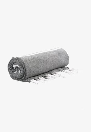 Textured gray and white woven blanket, rolled tightly with white fringes at one end. Features a simple, geometric pattern.