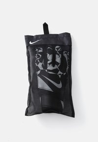 Nike training gloves in a black mesh bag. The gloves display a geometric gray and black pattern, with a logo near the top.