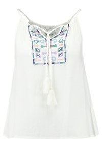 Biała bezrękawnikowa bluzka z ozdobnym haftowanym wykończeniem z wielokolorowymi wzorami i akcentami w postaci frędzli. Lekki, teksturowany materiał.