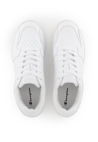 White leather sneakers feature perforated toe caps, flat laces, and a logo on the tongue. Textured soles provide grip and stability.