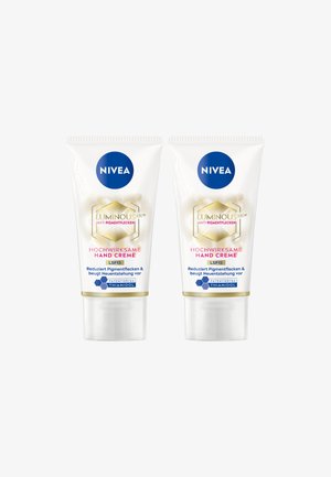 Two white Nivea Luminous 630 anti-pigment hand cream tubes with SPF 15, featuring patented Thiamidol formula.