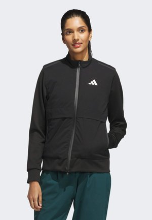 Black athletic jacket featuring a zip front, high collar, and gray panel accents. Includes a white logo on the upper left side.