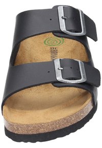 Black leather sandal featuring two adjustable silver buckles, cork footbed, and textured rubber sole for grip.