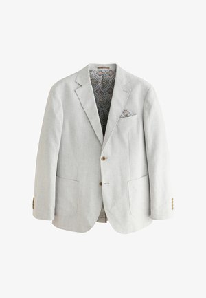 Gaišpelēka lina žakete ar teksturētu apdari. Ar zilu rakstainu oderi un saskaņotu kabatas lakatiņu. Divas priekšējās kabatas un pogu aizdare.