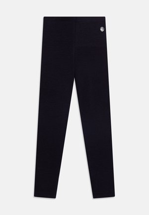 Schwarze Leggings aus weichem Stoff mit schmalem Schnitt. Enthält ein kleines Logo-Detail in der Nähe des Bundes.