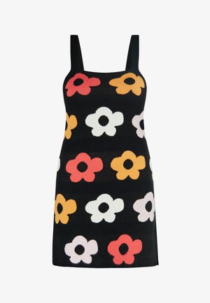 Robe sans manches noire ornée d'un motif floral avec des fleurs rouges, orange, blanches et roses, avec des centres noirs. Texture douce en tricot.