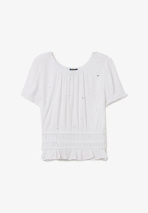 Weißes Kurzarm-Oberteil aus strukturiertem Stoff, mit gerafftem Taillenbereich und kleinen schimmernden Akzenten. Rüschen-Saumdetails.
