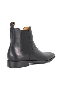 Black leather Chelsea boot with elastic side panels, sleek silhouette, tapered toe, and low block heel. Smooth texture and minimal accents.