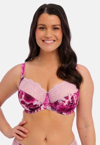 Pink floral lace underwire bra with sheer fabric, textured lace detailing at the top, and adjustable straps.