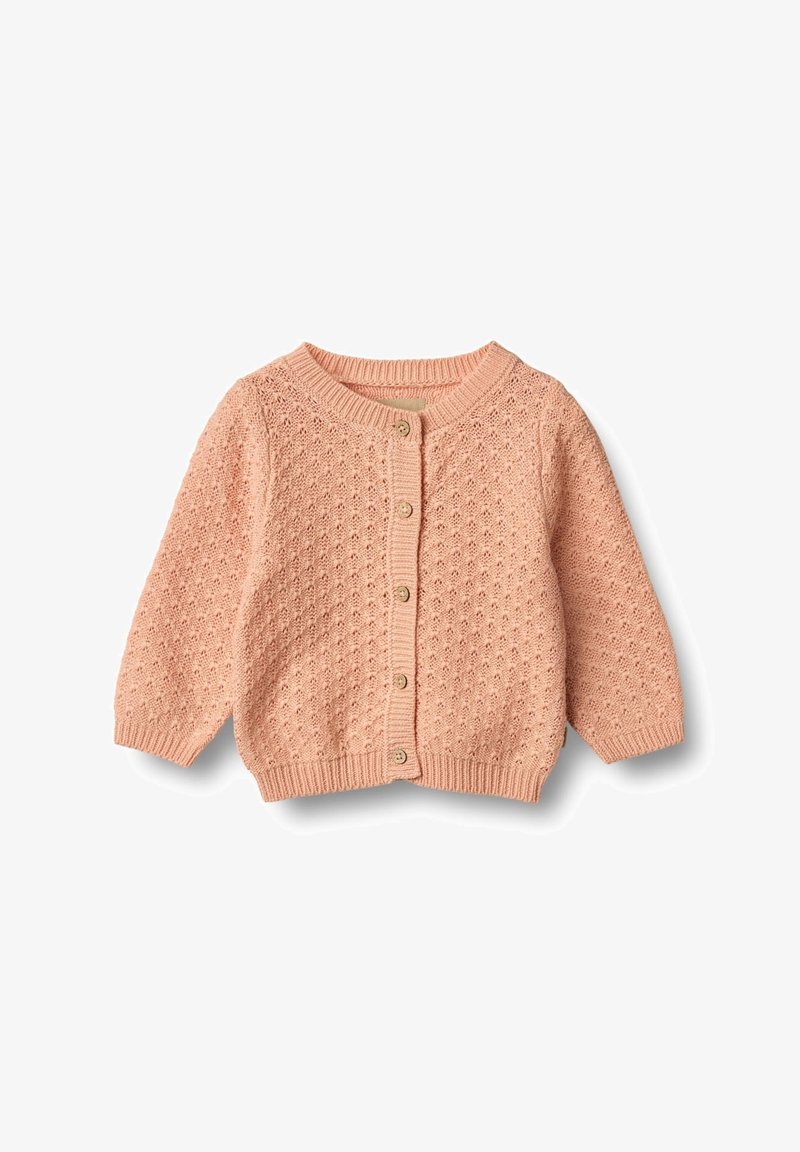 Šviesiai rožinė megzta kardiganas su tekstūruotu raštu, apvaliu iškirpimu ir penkiomis mygtukais. Turi ilgomis rankovėmis ir raukšlėtomis rankogaliais bei apačia.