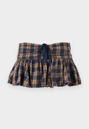 Plaid, flared mini skirt in brown and navy, made of lightweight fabric. Features a smocked waist and adjustable tie for fit.