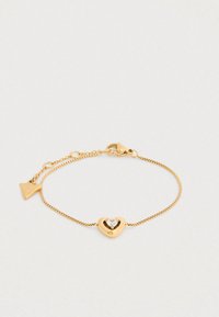 Βραχιόλι αλυσίδας σε χρυσό χρώμα με καρδιά στη μέση που φιλοξενεί ένα διαφανές πολύτιμο λίθο. Διαθέτει κλείσιμο με αρπαχτήρα και ρυθμιζόμενο μήκος.