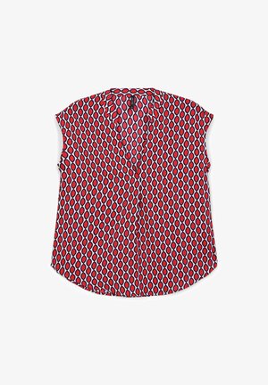 Blusa rossa a maniche corte con scollo a V, caratterizzata da un motivo geometrico di diamanti e cerchi alternati in bianco e nero.