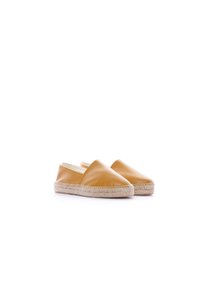 Espadrillas in pelle di colore giallo tenue, con suola in juta intrecciata e design slip-on senza tacco posteriore. Texture liscia.