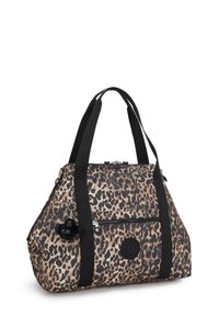 Leopard print tote bag with black handles, front zipper pocket, circular logo patch, and a small black plush keychain attached.