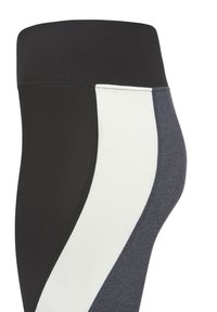 Zwarte high-waisted legging met kleurbloksecties in wit en donkergrijs. Soepele textuur, nauwsluitend ontwerp en gestikt detail.