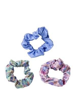 Set of three fabric scrunchies: one solid blue, one pastel green with space-themed patterns, and one pink with colorful floral designs.